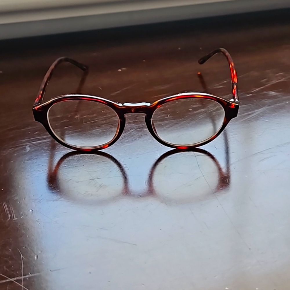 Small frame brown glasses with prescription lenses.   Fits  preteen